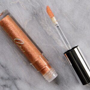 MAC Cosmetics Selena lipglass shade-hey dad pizza!